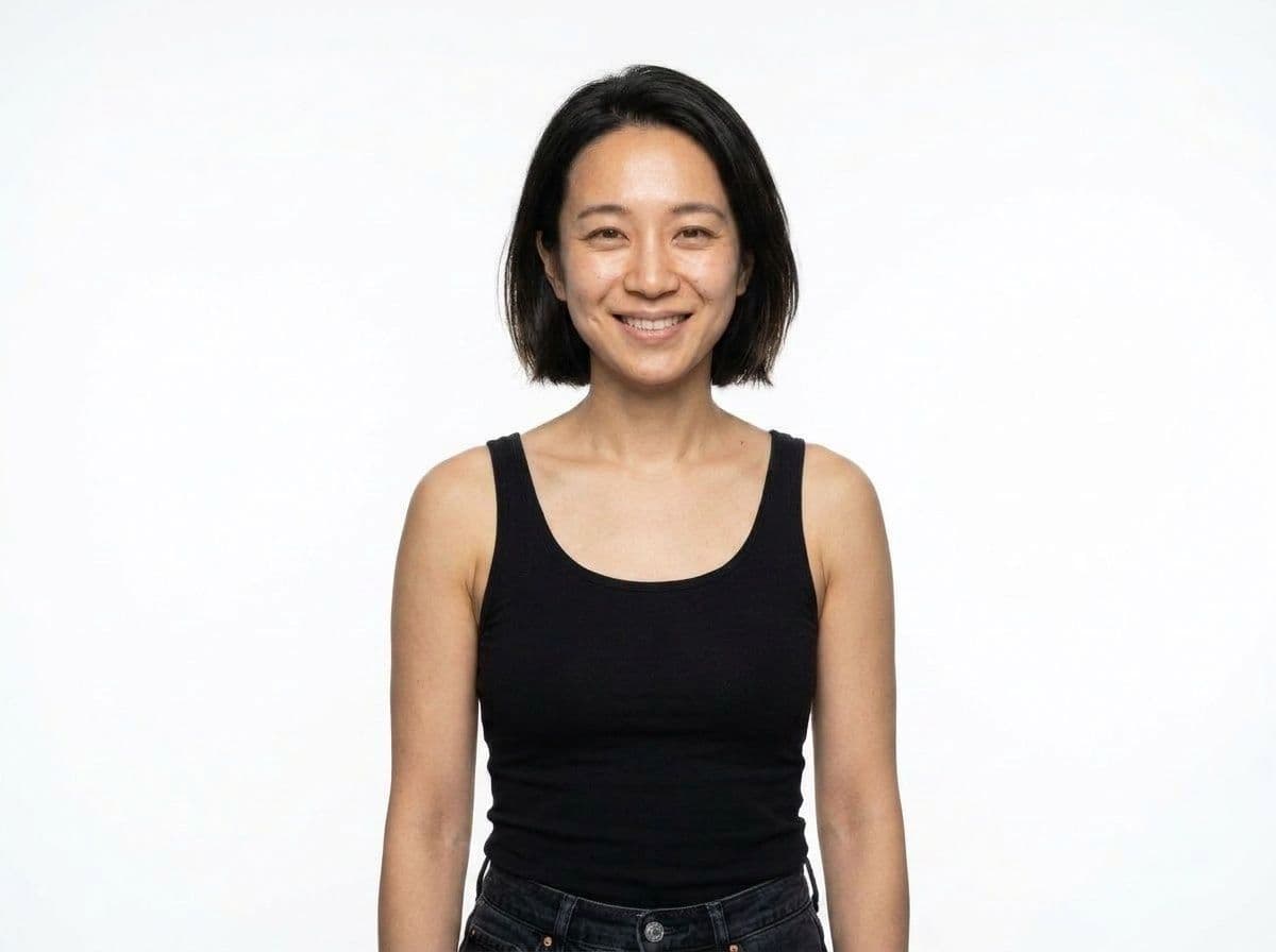 Clean minimal AI model headshot on a white seamless backdrop